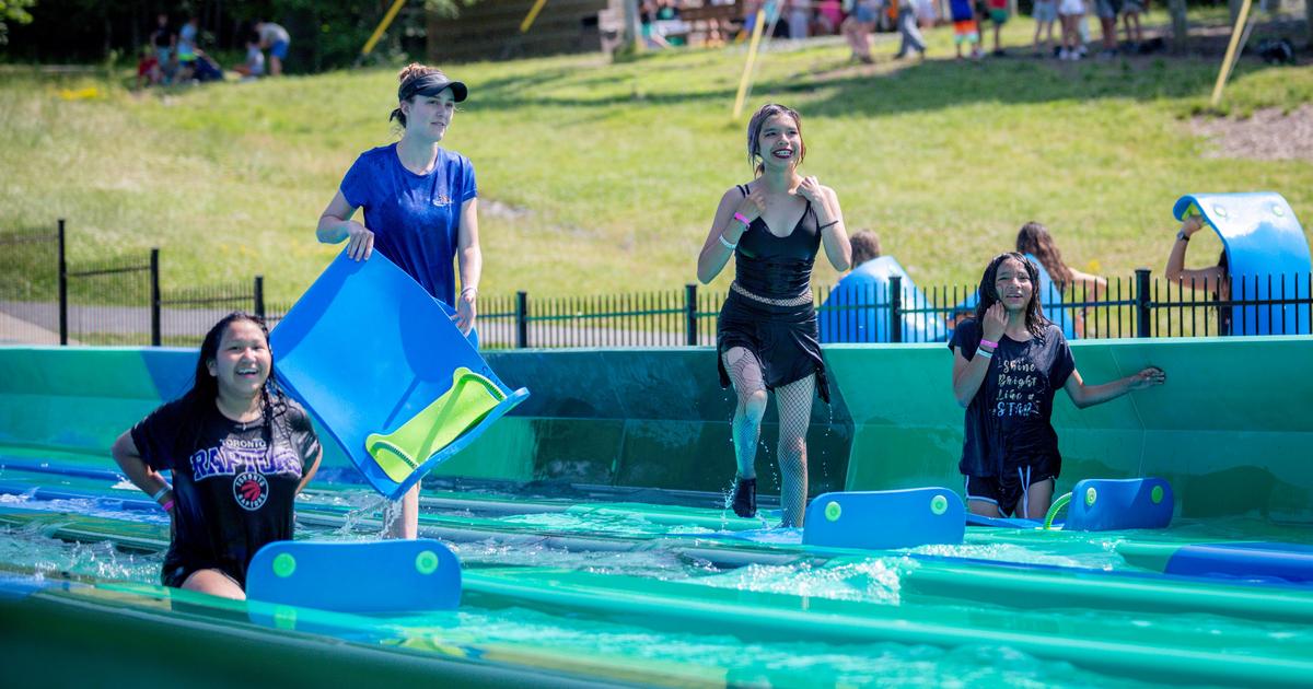Guests of Muskoka Woods having fun on the Kraken six-lane waterslide