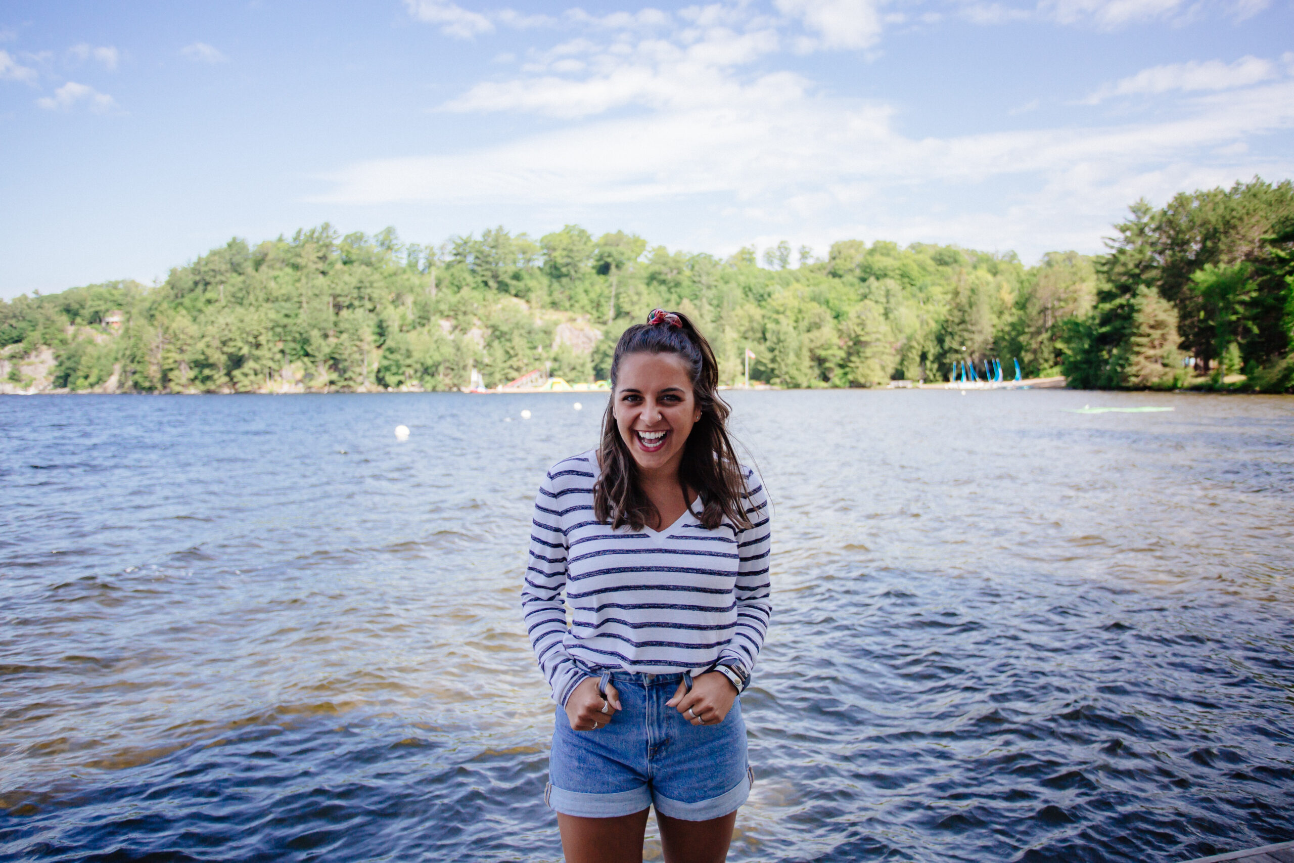 Antoinette Taranets standing in front of Lake Rosseau at Muskoka Woods.