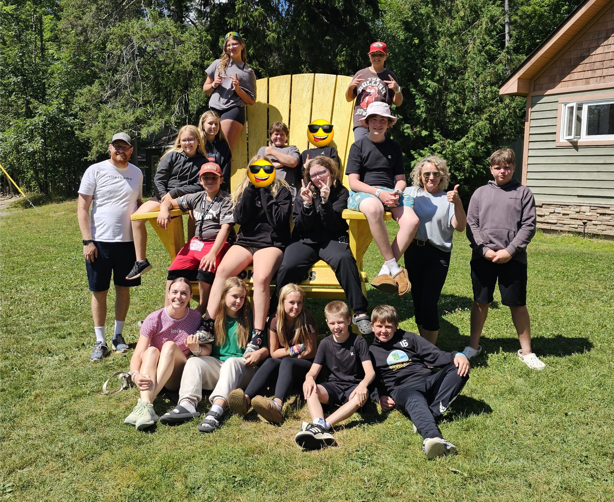 Melanie Koch poses at Muskoka Woods with a bunch of kids from Youth Unlimited YFC.